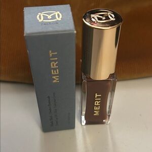 Merit shade slick tinted lip oil shade Falcon